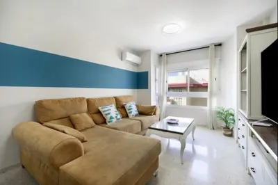 a living room with a couch and a tv at Agua Marina by Staycare in Rota