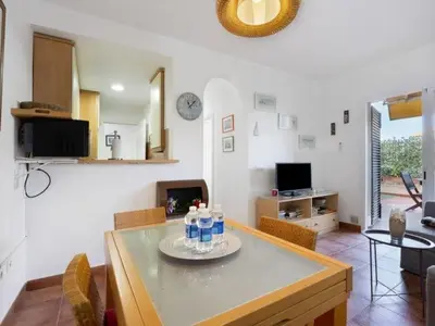 a living room with a table with bottles on it at Arrecife Home by Staycare in Rota