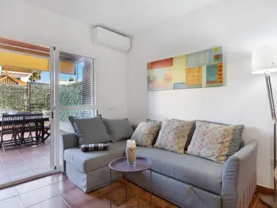 a living room with a couch and a table at Arrecife Home by Staycare in Rota