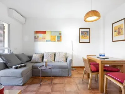 a living room with a couch and a table at Arrecife Home by Staycare in Rota