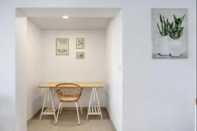 a table and two chairs in a white room at Atico castelar by Staycare in Rota