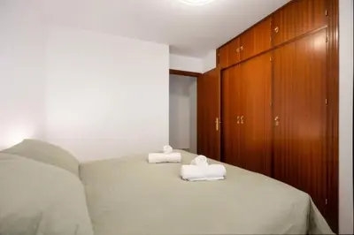a bedroom with two towels sitting on a bed at Girasoles Rota by Staycare in Rota