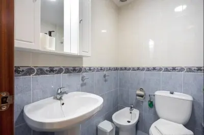 a bathroom with a sink and a toilet at Girasoles Rota by Staycare in Rota