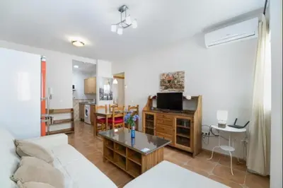 a living room with a couch and a table at Esperanza free parking by Staycare in Rota