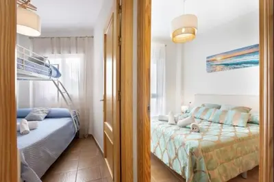 a bedroom with a bed and a bunk bed at Isaac Peral by Staycare in Rota
