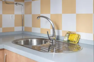 a sink with a faucet in a kitchen at Isaac Peral by Staycare in Rota