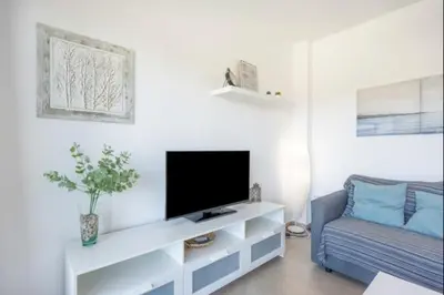 a living room with a tv and a couch at La Atalaya free parking by Staycare in Rota
