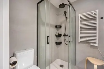 a bathroom with a glass shower and a toilet at Nerea Rota free parking by Staycare in Rota