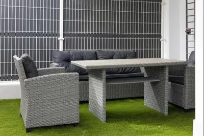 a table and two chairs on a patio at Paraíso Candor free parking by Staycare in Rota