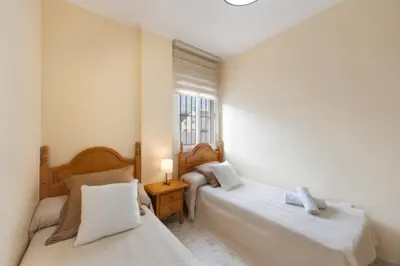a hotel room with two beds and a window at Sorolla Rota free parking by Staycare in Rota