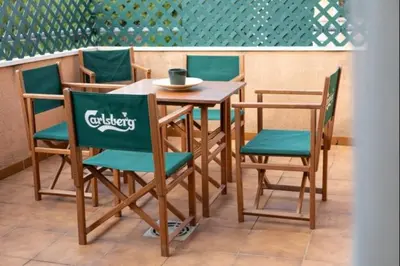 a table and chairs in a restaurant with a table and chairsktop at Sorolla Rota free parking by Staycare in Rota