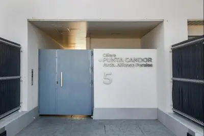 a building with a blue door and a sign at Luar Candor free parking by Staycare in Rota