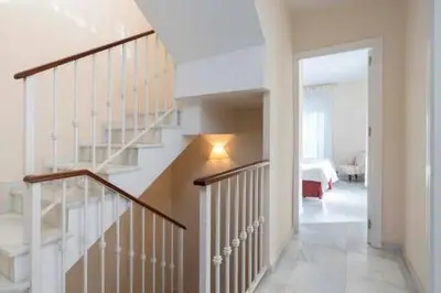 a hallway with a staircase in a house at Apartoyou - Torre Vistahermosa in El Puerto de Santa María