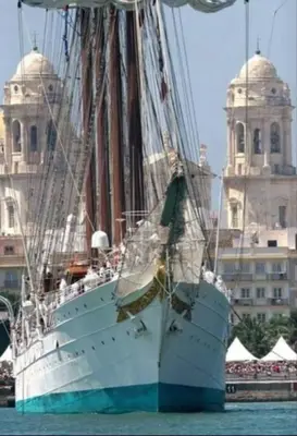 a large white boat sitting in the water at Piso Cádiz Playa Victoria in Cádiz