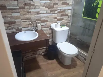 a bathroom with a toilet and a sink at Casita Playa Ballena in Rota