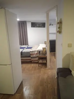 a bedroom with a bed and a couch in a room at Casita Playa Ballena in Rota