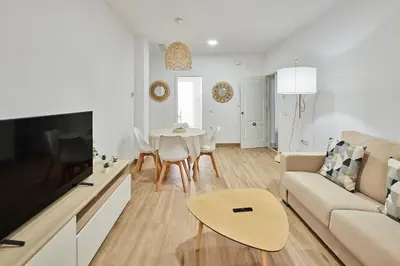 a living room with a couch and a table at Cádiz, ciudad y playa in Cádiz
