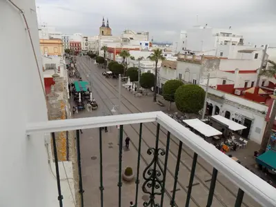 a view of a city street from a balcony at Plaza del Rey Apartments in San Fernando
