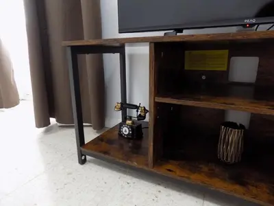 a tv stand with a camera on top of it at Plaza del Rey Apartments in San Fernando