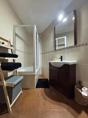 a bathroom with a sink and a mirror at Casa Azacanes in Sanlúcar de Barrameda