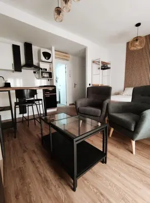 a living room with a couch and a coffee table at Amber Suite in Jerez de la Frontera