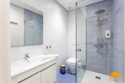a bathroom with a shower and a sink and a toilet at Apartamento El Patio by Cadiz Time in Cádiz