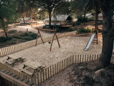a park with a swing set and a playground at wecamp Cádiz in Cádiz