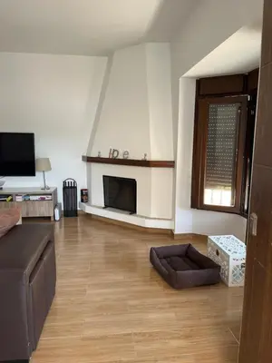 a living room with a couch and a fireplace at Rincón del mar in Novo Sancti Petri