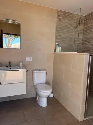 a bathroom with a toilet and a sink at Rincón del mar in Novo Sancti Petri