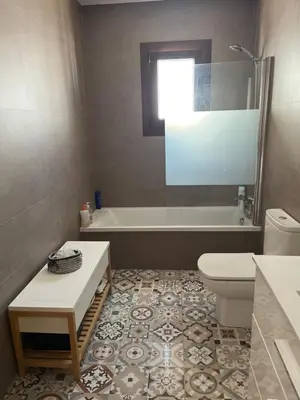 a bathroom with a tub and a toilet and a sink at Rincón del mar in Novo Sancti Petri