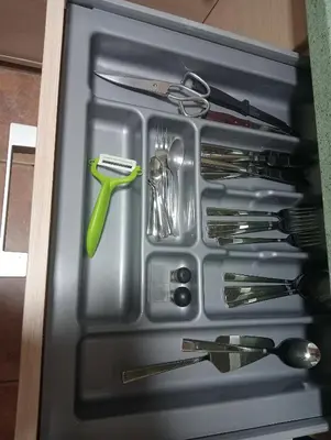a drawer full of utensils in a container at Como en casa in Jerez de la Frontera