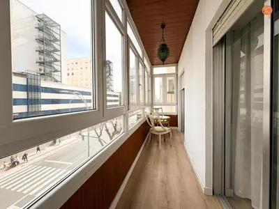 a hallway with windows and a view of a city at Mar de Viya Grupo AC Gestion in Cádiz