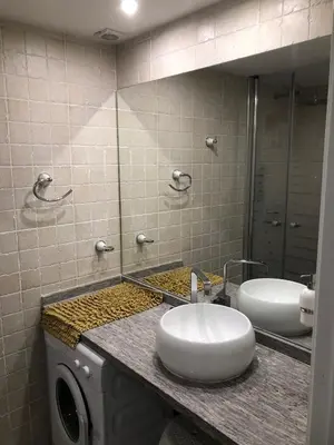 a bathroom with a sink and a mirror at Casa Palacio en Casco Antiguo in El Puerto de Santa María