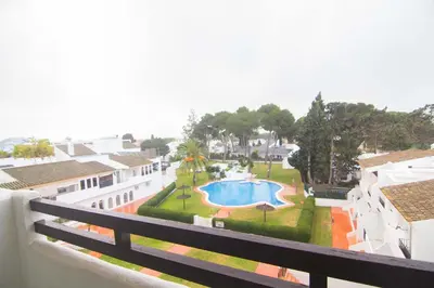 a view of a swimming pool from a balcony at Apartamento Vistahermosa terraza y piscina in El Puerto de Santa María