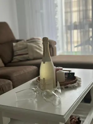a bottle of milk sitting on a coffee table at Ático primera línea en costa ballena in Rota