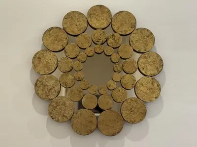 a circle of coins on a wall at Casa Luada in Sanlúcar de Barrameda