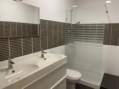 a bathroom with a sink and a toilet and a shower at Casa Luada in Sanlúcar de Barrameda