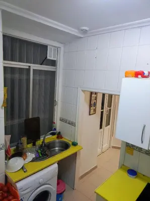 a small kitchen with a sink and a washing machine at Old Merchant's Home in Cádiz