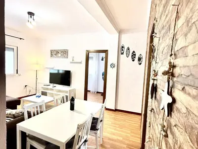 a living room with a white table and chairs at Los 3 hermanos by Staycare in Rota
