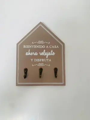 a plaque on a wall with a sign on it at Chipiona Center in Chipiona
