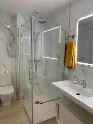 a bathroom with a shower and a sink and a toilet at Arenas de Doñana in Sanlúcar de Barrameda