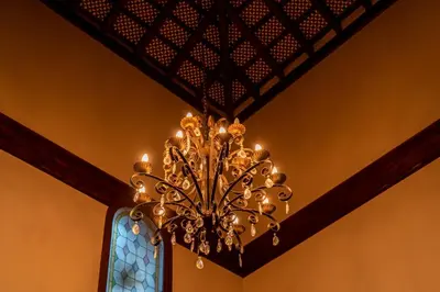 a chandelier hanging from a ceiling in a room at Hotel Azalea Playa in Chiclana de la Frontera