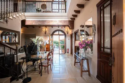 a dining room with a table and chairs at Hotel Azalea Playa in Chiclana de la Frontera