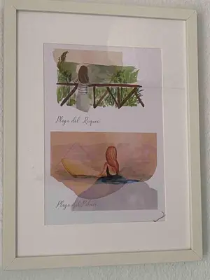 a framed picture of a painting of a woman at Casa 77, la playa más bonita a 150 metros in Conil de la Frontera