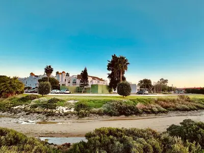 a view of a street with a road and buildings at Piso Bahia in Chiclana de la Frontera