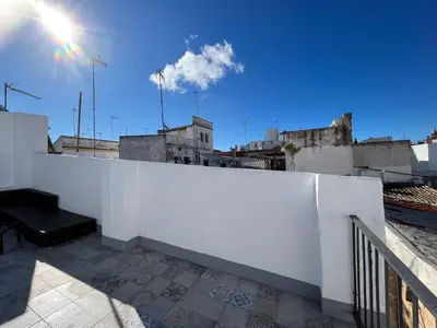 a white fence on top of a building at El Encanto de Jerez in Jerez de la Frontera