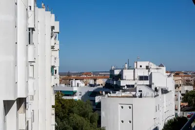 an aerial view of buildings in a city at Sibs Sanlucar RIOMAR-Renovado Centrico vistas in Sanlúcar de Barrameda