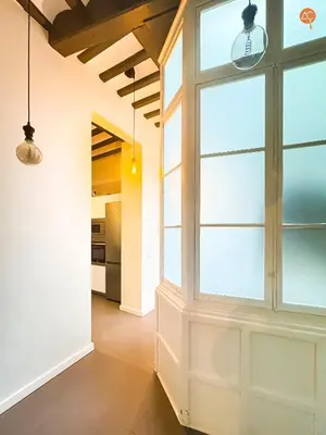 a hallway with a large window in a house at Ámbar Loft Grupo AC Gestion in Cádiz