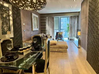 a living room with a table and a couch at Terra Boutique Cádiz in Cádiz