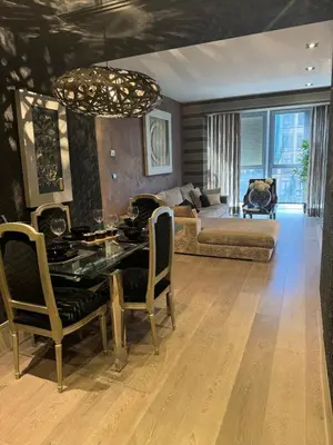 a living room with a table and a couch at Terra Boutique Cádiz in Cádiz